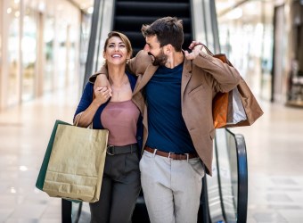 Happy Couple Shopping in Mall